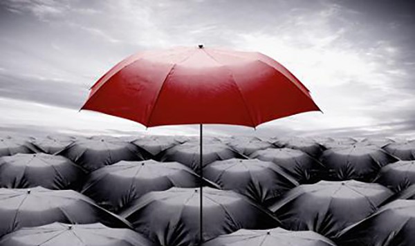 authenticity3 red umbrella rising above a sea of black umbrellas